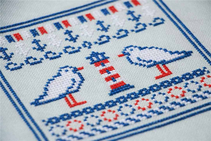 A stitched preview of the counted cross stitch pattern Sea Sampler by Kate Spiridonova