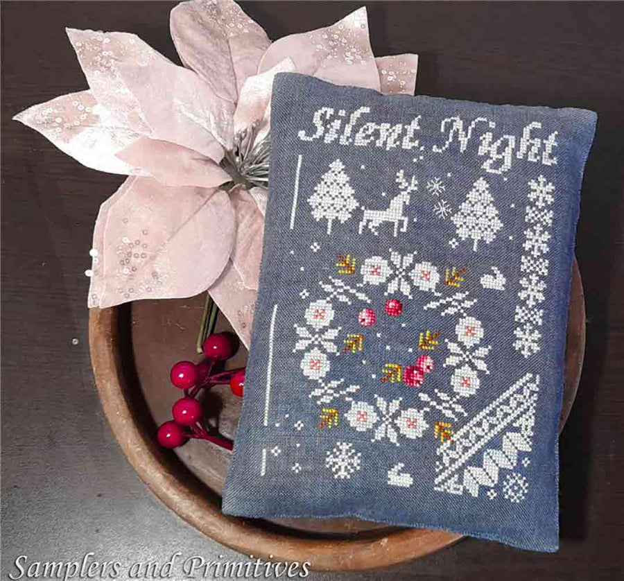 A stitched preview of the counted cross stitch pattern Silent Night by Samplers and Primitives