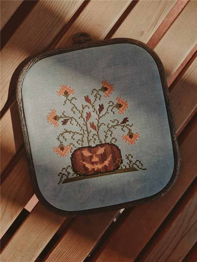 A stitched preview of the counted cross stitch pattern Spooky Pumpkin by Kate Spiridonova