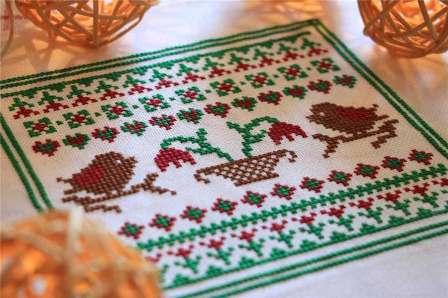 A stitched preview of the counted cross stitch pattern Spring Sampler by Kate Spiridonova