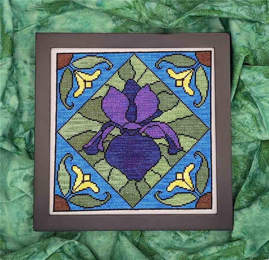 A stitched preview of the counted cross stitch pattern Stained Glass Purple Iris by KEB Studio Creations