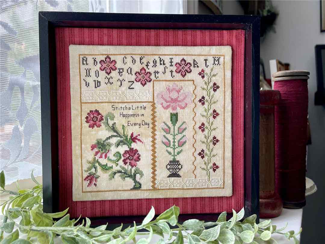 A stitched preview of the counted cross stitch pattern Stitch Happiness by Jan Hicks Creates