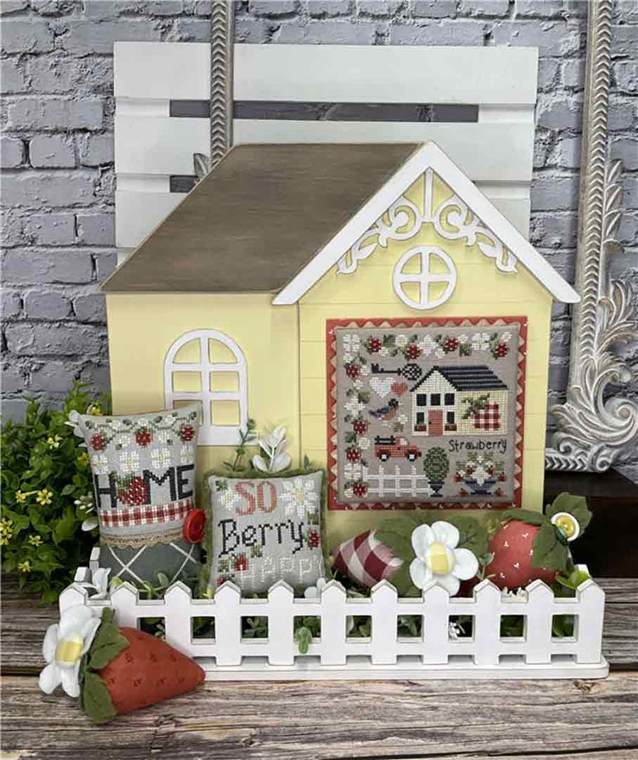 A stitched preview of the counted cross stitch pattern Strawberry House by Erin Elizabeth Designs