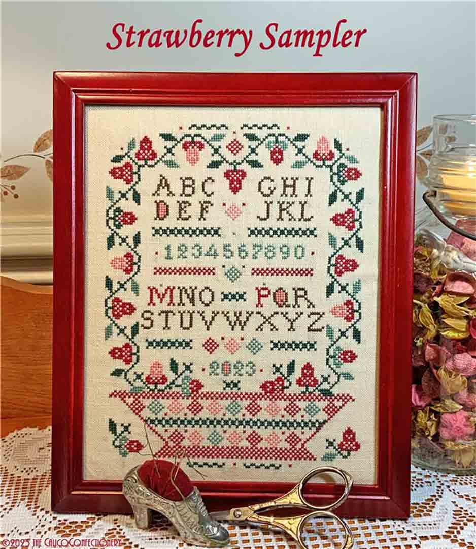 A stitched preview of the counted cross stitch pattern Strawberry Sampler by The Calico Confectionery