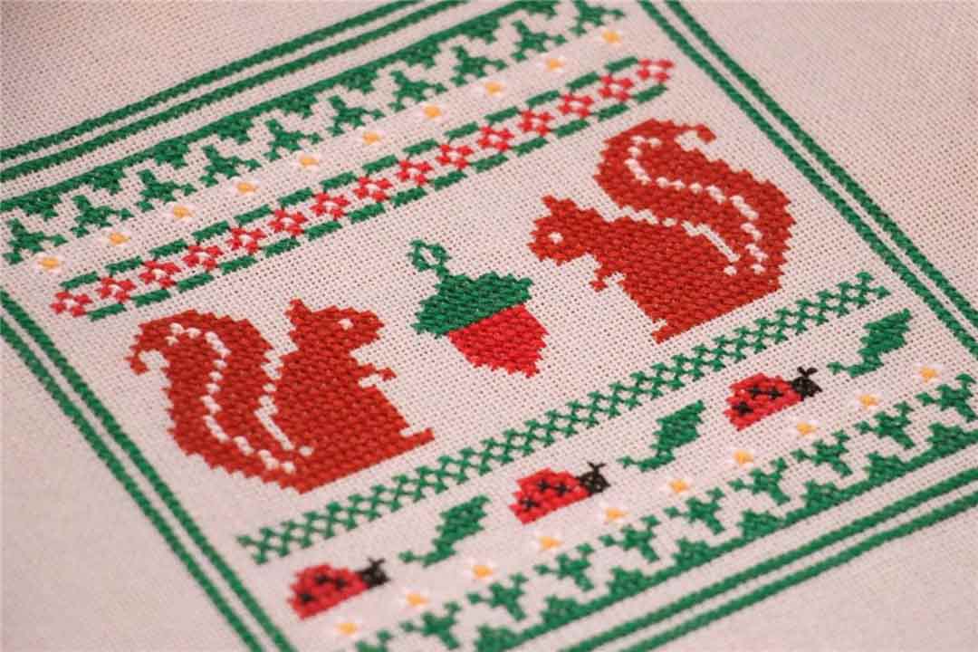 A stitched preview of the counted cross stitch pattern Summer Sampler by Kate Spiridonova