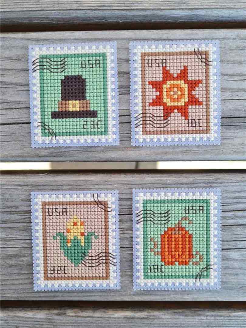 A stitched preview of the counted cross stitch pattern Thanksgiving Postage Stamps by Kate Spiridonova