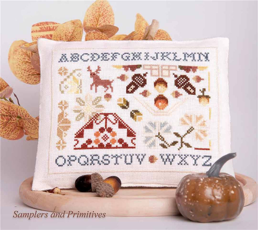 A stitched preview of the counted cross stitch pattern The Autumn Alphabet by Samplers and Primitives