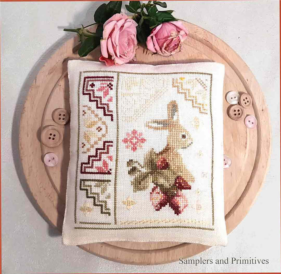 A stitched preview of the counted cross stitch pattern The Bunny Quaker by Samplers and Primitives