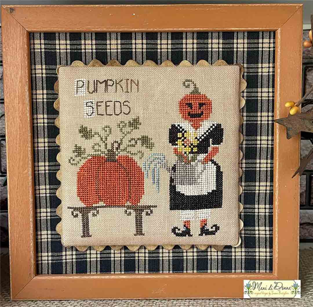 A stitched preview of the counted cross stitch pattern The Seeds Of Lady Pumpkins by Mani di Donna Design