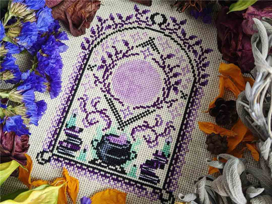 A stitched preview of the counted cross stitch pattern Under The Sanguine Moon by StitchSprout