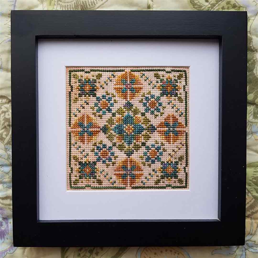 A stitched view of the counted cross stitch pattern Where The Fae Play by Carolyn Manning Designs