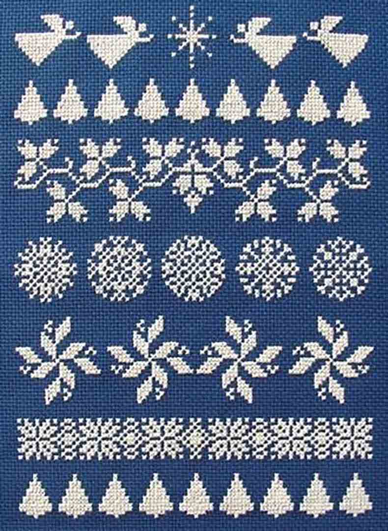 A stitched preview of the counted cross stitch pattern White On Blue Christmas Sampler by Janis Lockhart