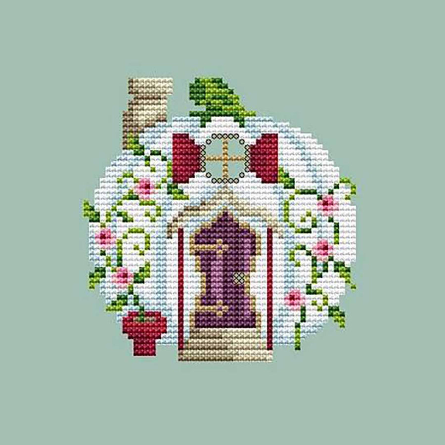 A stitched preview of the counted cross stitch pattern White Pumpkin House by Shannon Christine Designs