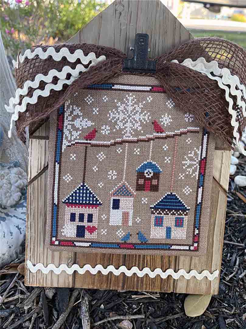 A stitched preview of the counted cross stitch pattern Winter Cottages by Jan Hicks Creates