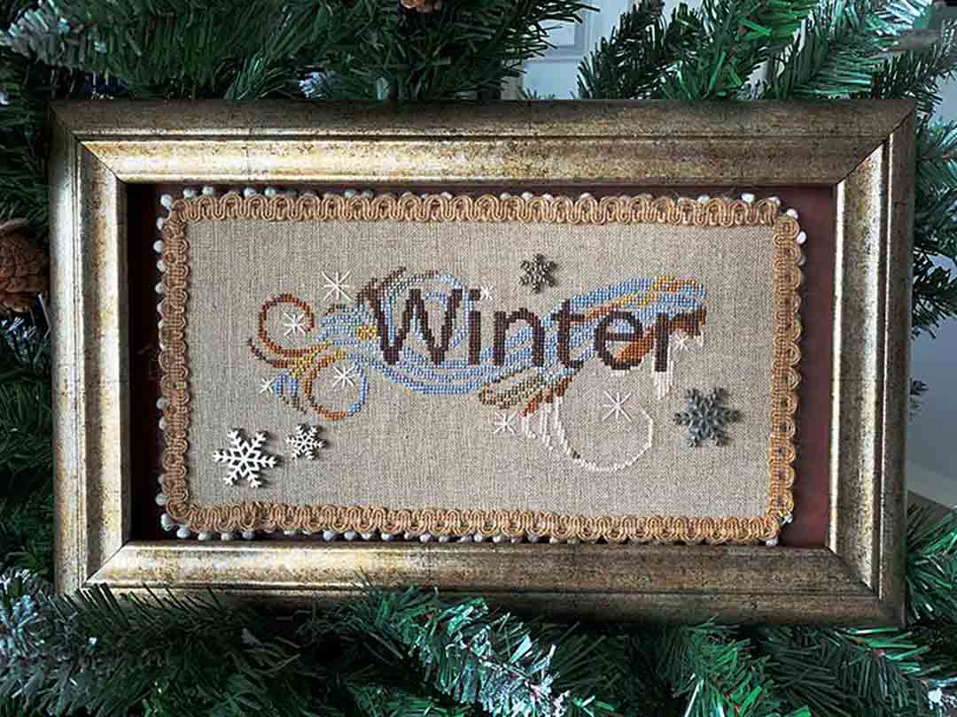 A stitched preview of the counted cross stitch pattern Winter Flourish by Jan Hicks Creates