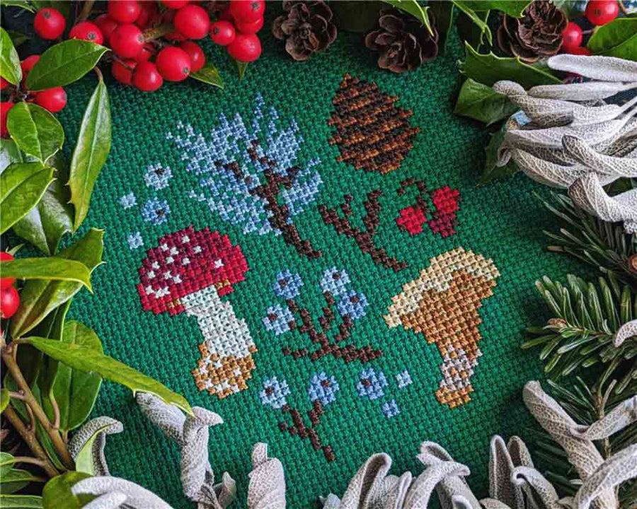 A stitched preview of the counted cross stitch pattern Winter Forage Sampler by StitchSprout