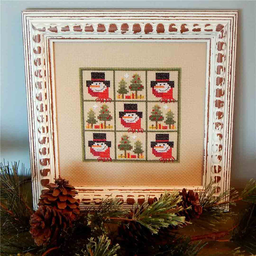 A stitched preview of the counted cross stitch pattern Winter Pines by Prairie Grove Peddler