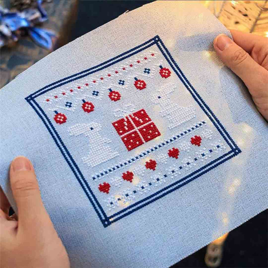 A stitched preview of the counted cross stitch pattern Winter Sampler by Kate Spiridonova