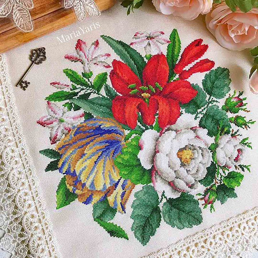 A stitched preview of the counted cross stitch pattern Antique Berlin Lilies and Roses Bouquet by Antique Needlework Design