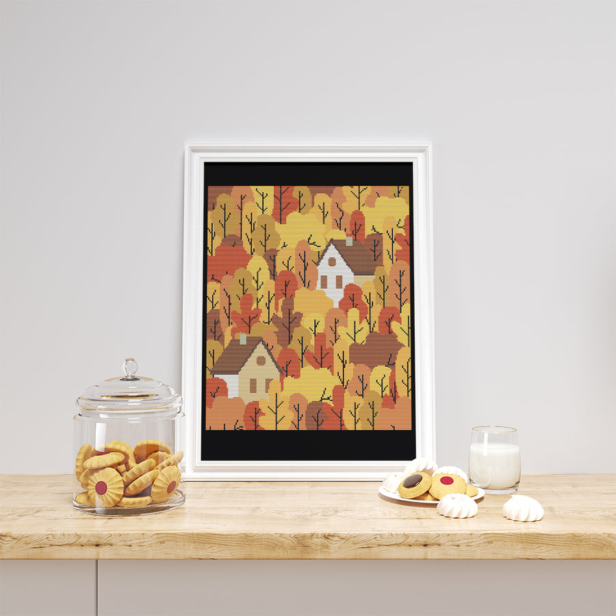 Stitched and framed preview of Autumn Village Counted Cross Stitch Pattern and Kit