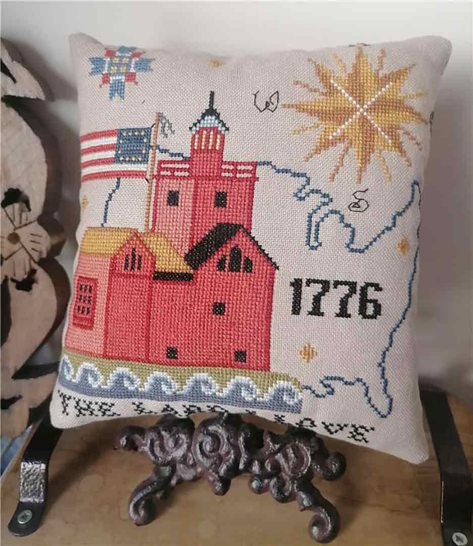 A stitched preview of the counted cross stitch pattern Patriotic Book 2024 by Twin Peak Primitives