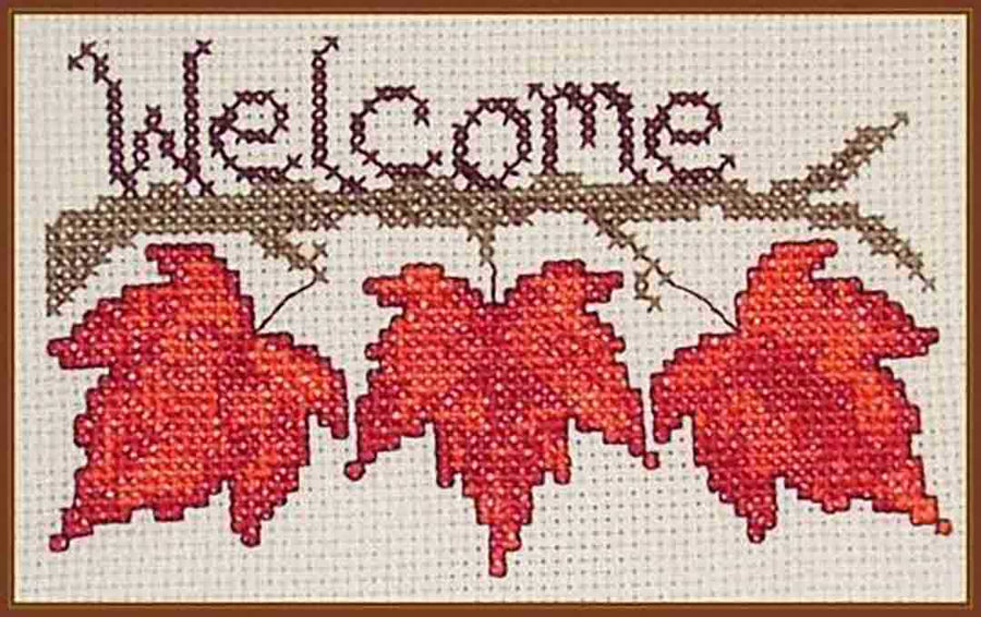 An image of a stitched preview of the counted cross stitch pattern Fall Leaf Welcome by Janis Lockhart