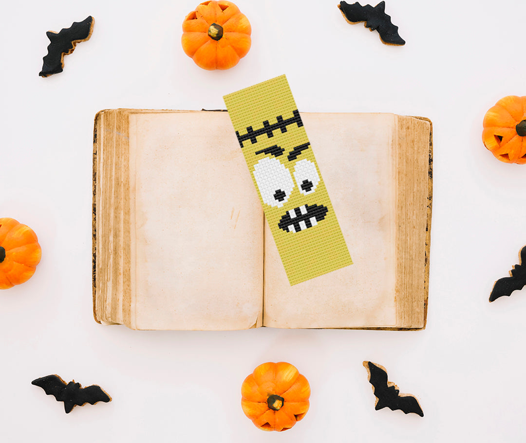 A stitched preview of the free counted cross stitch pattern "Halloween Bookmark" by Stitch Wit