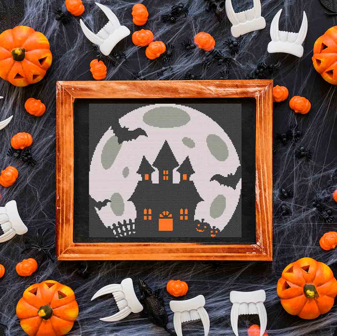 A stitched preview of the counted cross stitch pattern and kit "Haunted Moon" by Stitch Wit