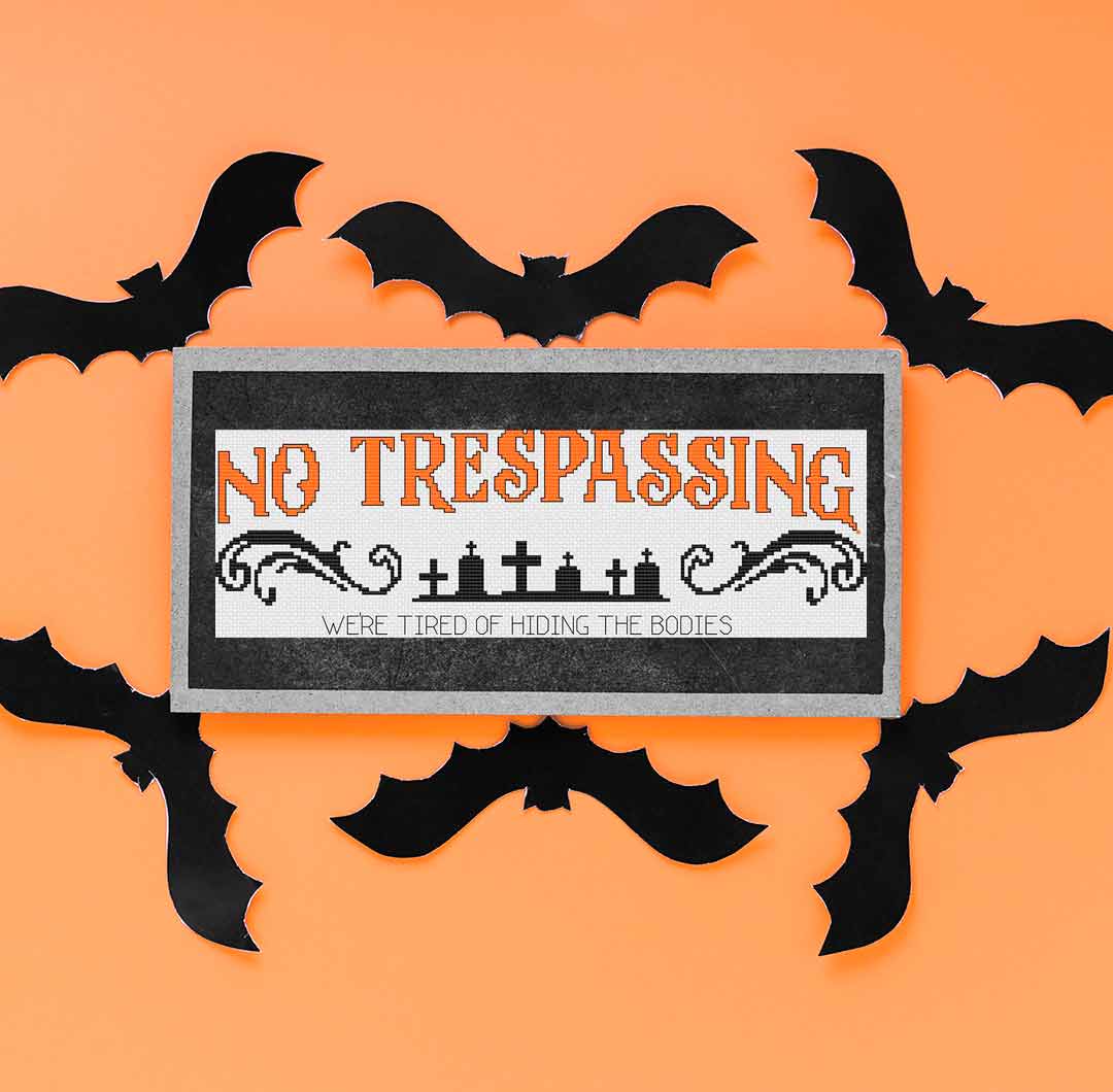 A stitched preview of the counted cross stitch pattern and kit "No Trespassing" by Stitch Wit