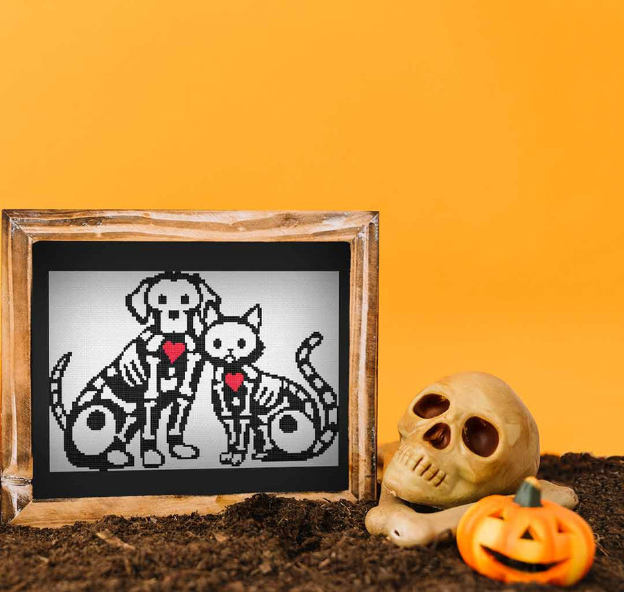 Image of stitched and framed preview of "Pet Skeletons"  Counted Cross Stitch Pattern and Kit by Stitch Wit