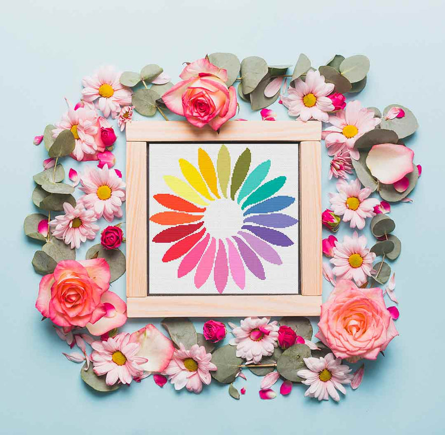 A stitched preview of the counted cross stitch pattern and kit "Rainbow Petals" by Stitch Wit