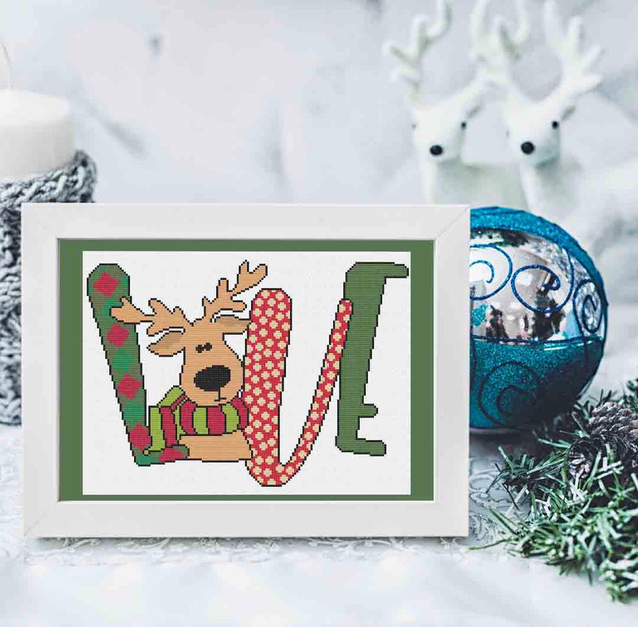Image of stitched and framed preview of "Reindeer Love" a counted cross stitch pattern and kit by Stitch Wit