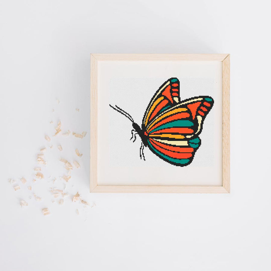 A stitched preview of the counted cross stitch pattern and kit "Retro Butterfly" by Stitch Wit