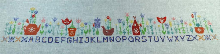A stitched preview of the counted cross stitch pattern Rustic Alphabet by Alessandra Adelaide