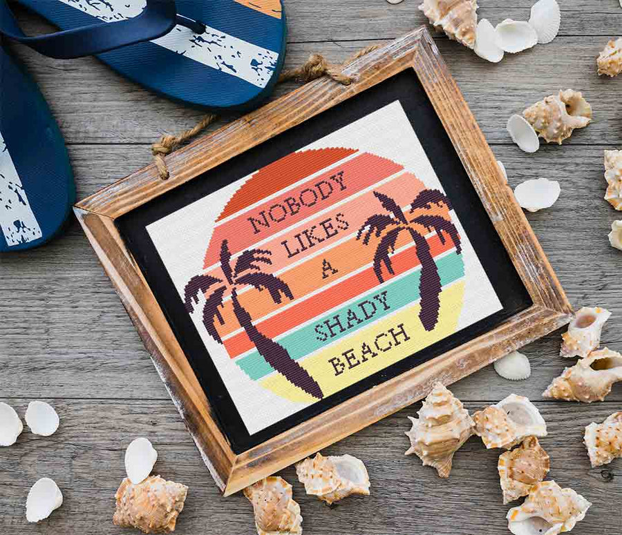 A stitched preview of the counted cross stitch pattern "Shady Beach" by Stitch Wit