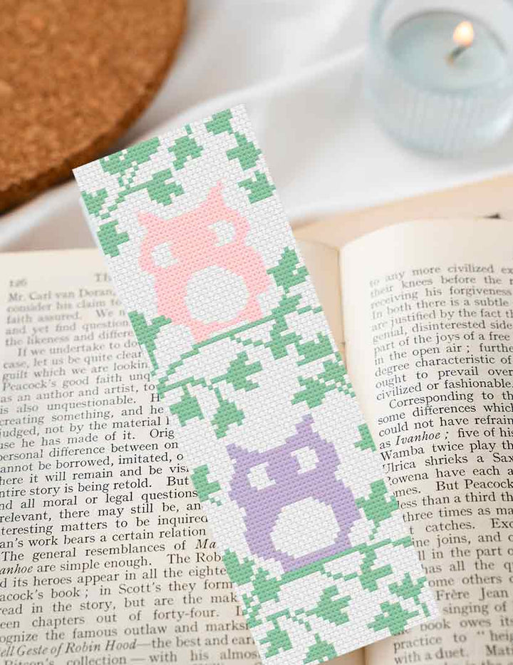 A stitched preview of the free counted cross stitch pattern "Two Spring Owls Bookmark"