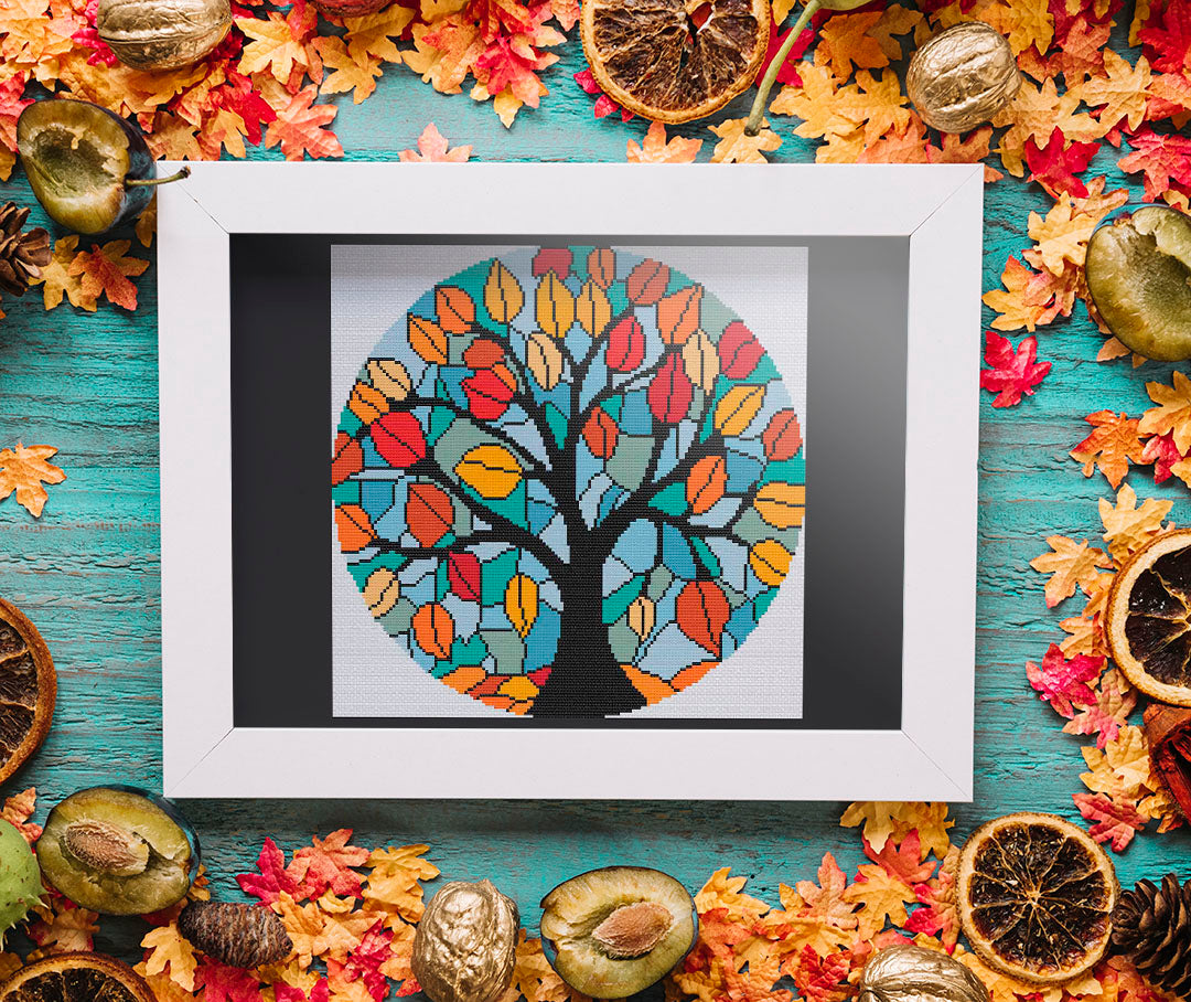 A stitched preview of the counted cross stitch pattern and kit "Stained Glass Autumn Leaves"