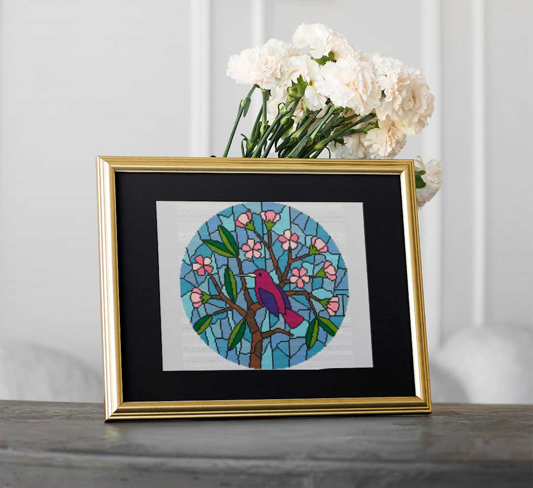 A stitched preview of Stained Glass Bird In A Tree: Counted Cross Stitch Pattern and Kit by Stitch Wit