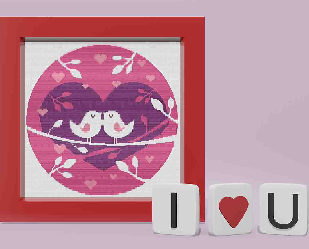 Stitched and framed preview of Love Birds Counted Cross Stitch Pattern and Kit