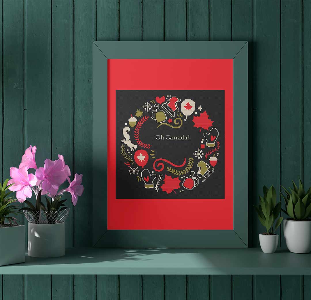 Stitched and framed preview of Canada Day Wreath Counted Cross Stitch Pattern and Kit