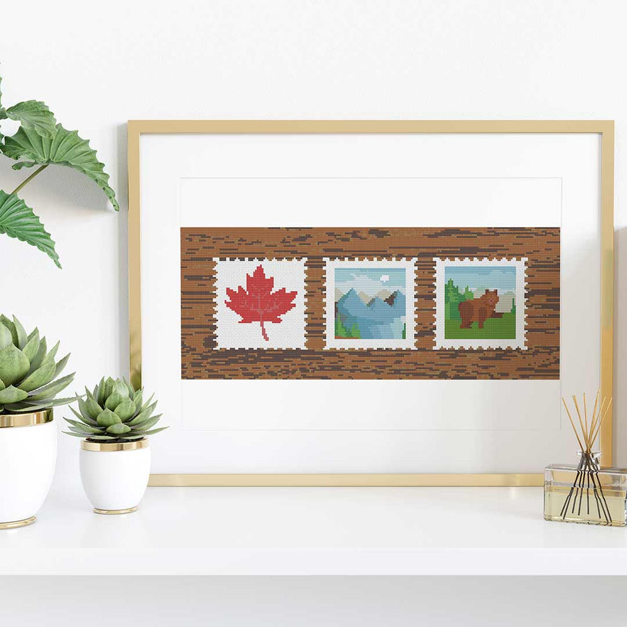 Stitched and framed preview of Canadian Stamps Counted Cross Stitch Pattern and Kit