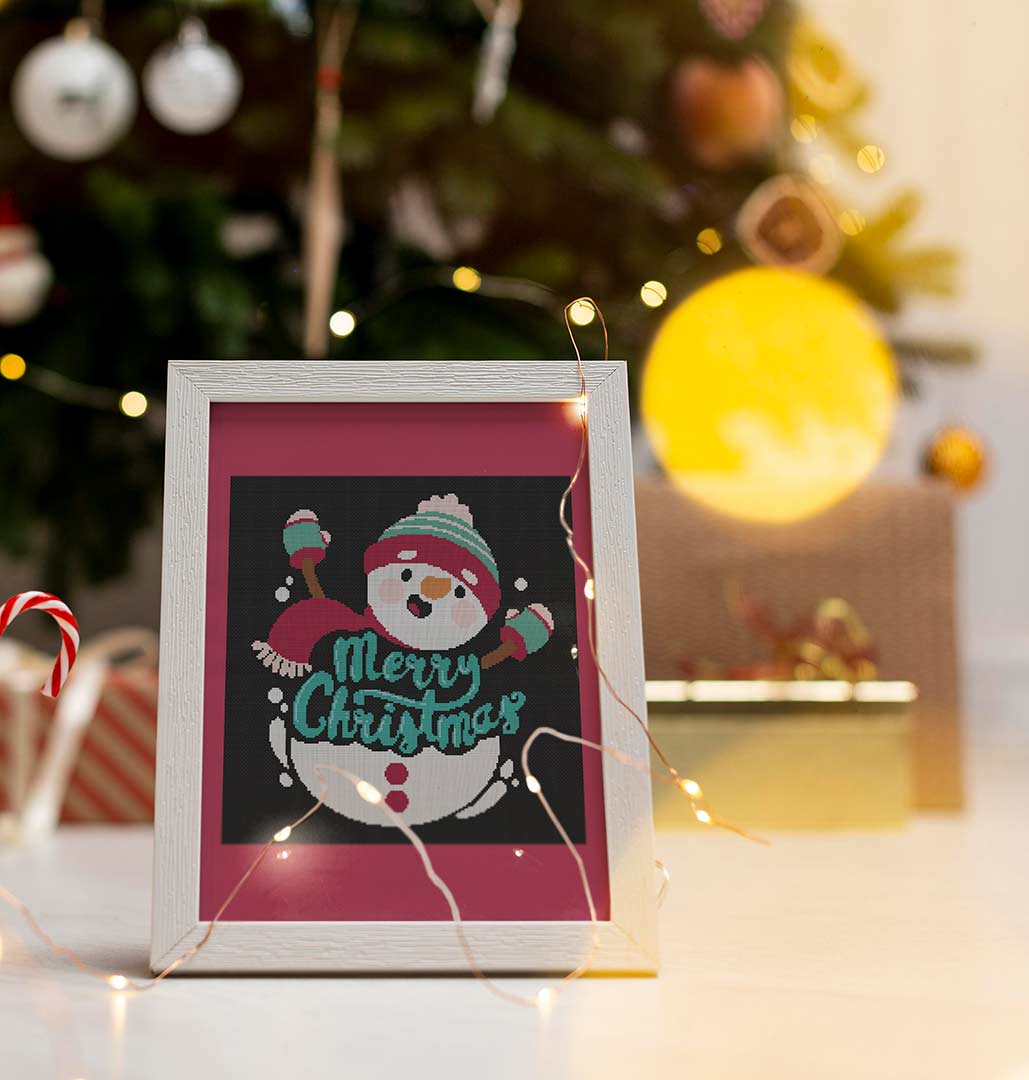 Stitched and framed preview of Christmas Snowman Counted Cross Stitch Pattern and Kit