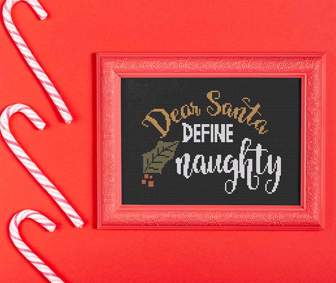 Stitched and framed preview of Define Naughty Counted Cross Stitch Pattern and Kit