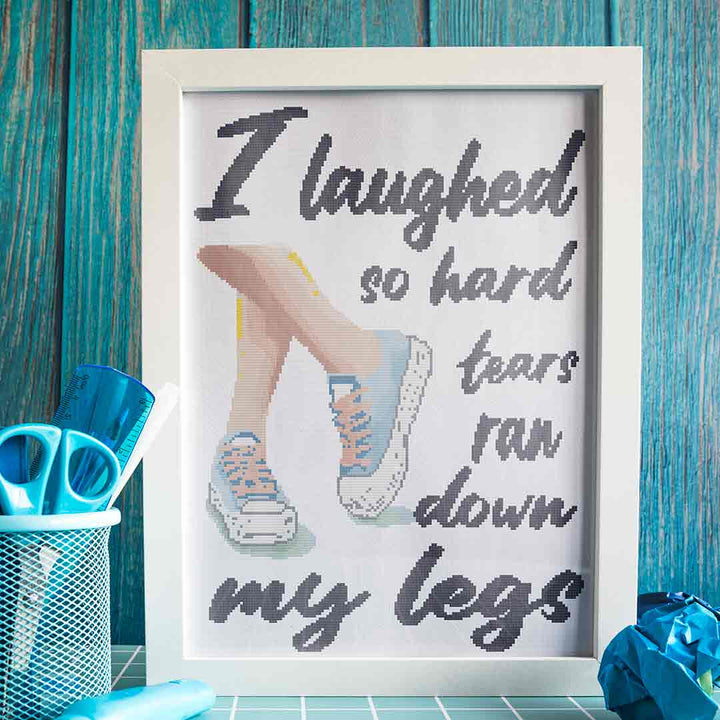 Stitched and framed preview of Down My Legs Counted Cross Stitch Pattern and Kit