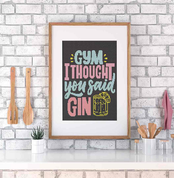 Stitched and framed preview of Gym Or Gin Counted Cross Stitch Pattern and Kit