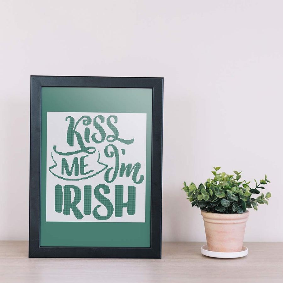 Stitched and framed preview of Kiss Me Counted Cross Stitch Pattern and Kit