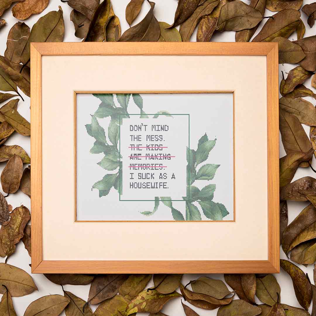Stitched and framed preview of Mind The Mess Counted Cross Stitch Pattern and Kit