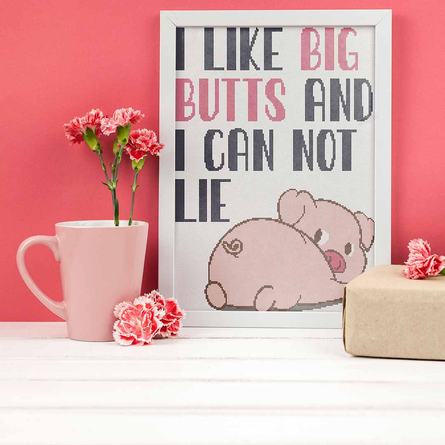Stitched and framed preview of Pig Butts Counted Cross Stitch Pattern and Kit
