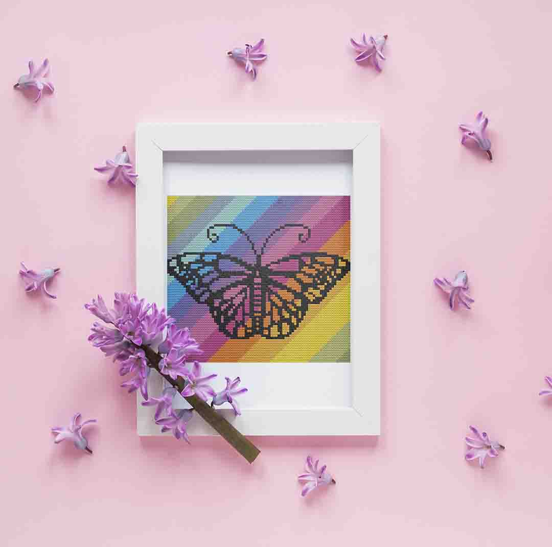 Stitched and framed preview of Rainbow Butterfly Counted Cross Stitch Pattern and Kit