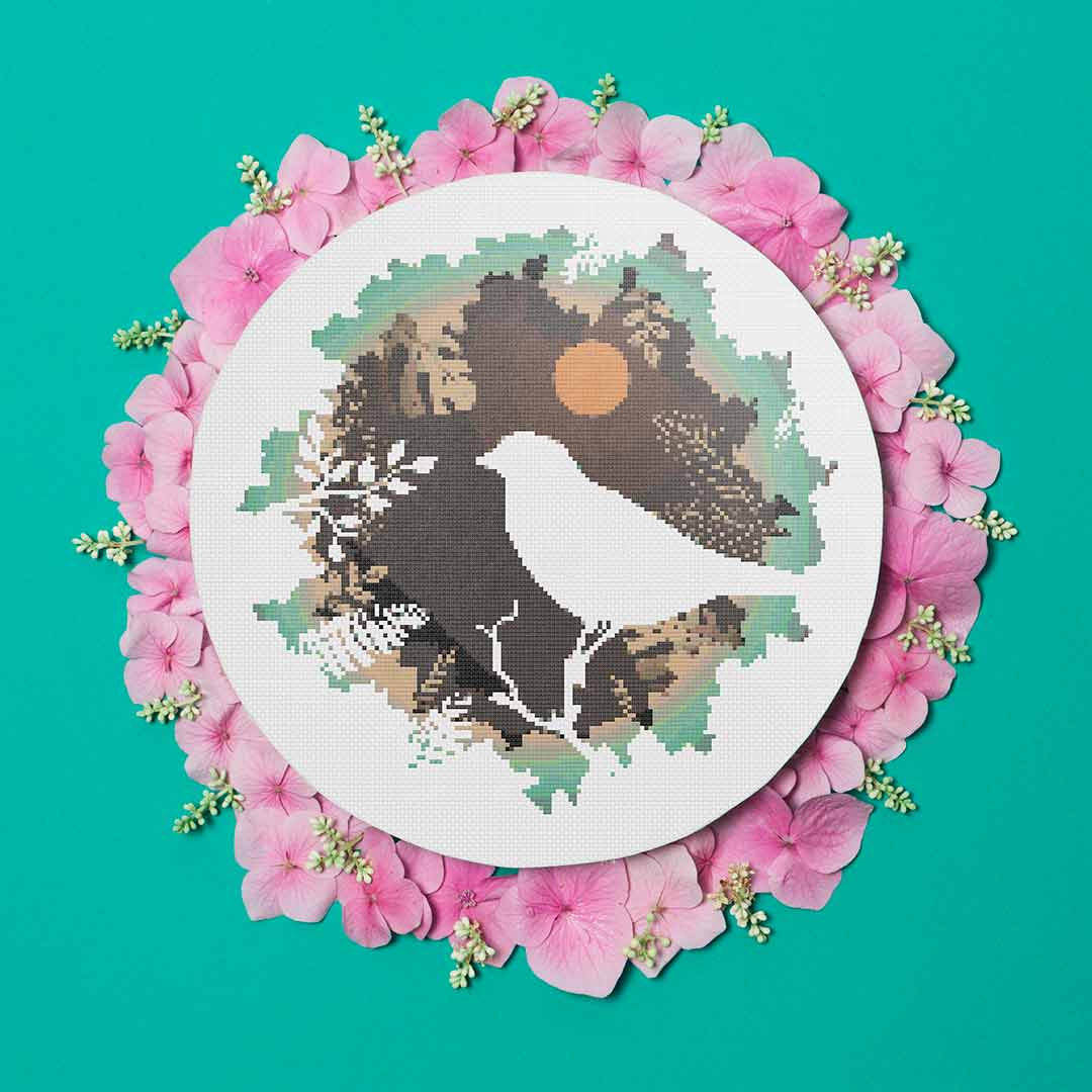 Stitched and framed preview of Silhouette Bird Counted Cross Stitch Pattern and Kit